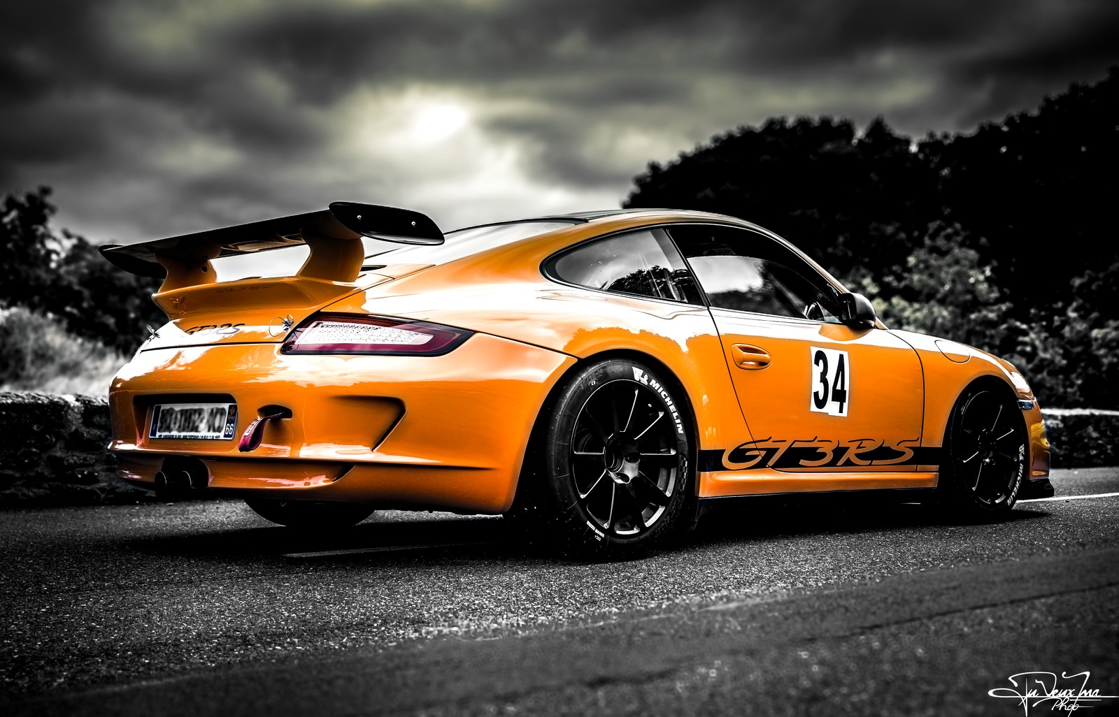 Porsche 911 GT3 RS on track at sunset